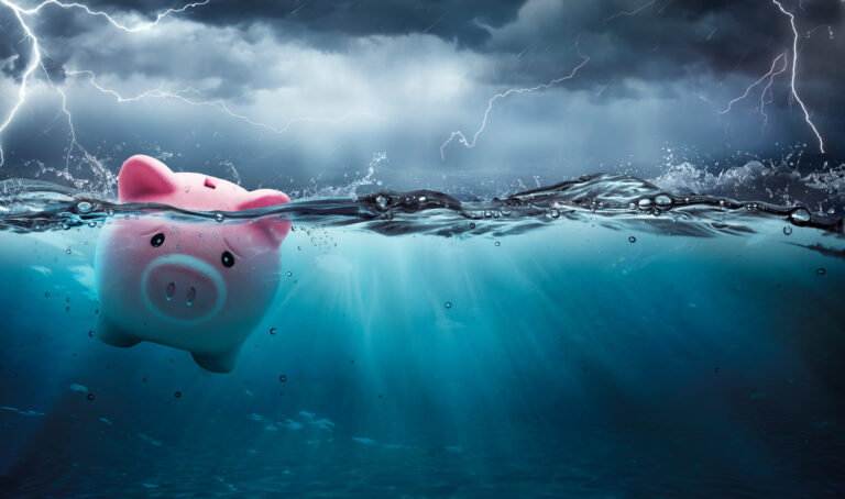 Piggy Bank Drowning In The Ocean